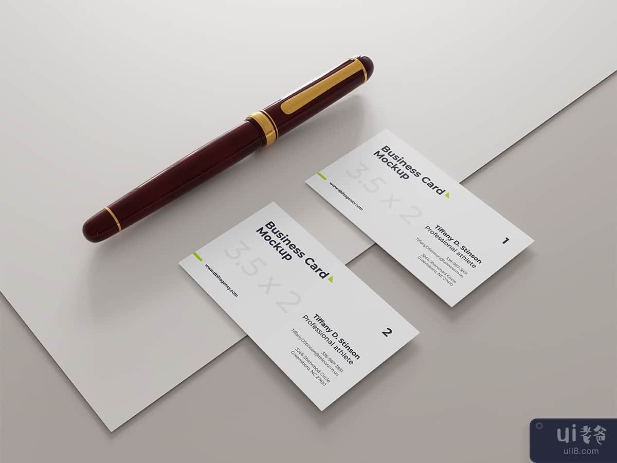 Business card mockup with pen right view